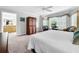 Main bedroom with king bed, sitting area, and ensuite bathroom access at 219 81St St, Holmes Beach, FL 34217