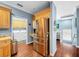 Kitchen features stainless steel appliances and access to laundry room at 219 81St St, Holmes Beach, FL 34217