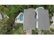 Aerial view showing a home with private pool and spa, surrounded by lush landscaping at 219 81St St, Holmes Beach, FL 34217