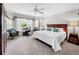 Spacious bedroom with king bed, sitting area, and large windows at 219 81St St, Holmes Beach, FL 34217