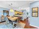 Spacious dining area with hardwood floors and light wood table at 219 81St St, Holmes Beach, FL 34217