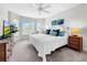 Spacious bedroom with a king-size bed, large windows, and plenty of natural light at 219 81St St, Holmes Beach, FL 34217