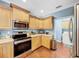 Stainless steel appliances and ample cabinetry in this kitchen at 219 81St St, Holmes Beach, FL 34217