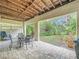 Brick paved patio with seating area and lush greenery at 219 81St St, Holmes Beach, FL 34217