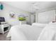 Bedroom with two twin beds and TV at 219 81St St, Holmes Beach, FL 34217