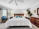 Comfortable bedroom with king bed, window seat, and wood accents at 219 81St St, Holmes Beach, FL 34217