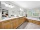 Double vanity bathroom with soaking tub and separate shower at 219 81St St, Holmes Beach, FL 34217