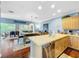 Open kitchen with island, stainless steel appliances, and breakfast bar at 219 81St St, Holmes Beach, FL 34217