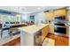 Modern kitchen with stainless steel appliances and light wood cabinets at 219 81St St, Holmes Beach, FL 34217