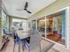 Spacious screened balcony offering an outdoor dining area with scenic views at 219 81St St, Holmes Beach, FL 34217