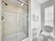 Clean bathroom with shower stall, toilet and linen storage at 219 81St St, Holmes Beach, FL 34217