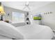 Bedroom with two twin beds and TV at 219 81St St, Holmes Beach, FL 34217