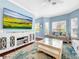Living room with light walls, hardwood floors, and plenty of natural light at 219 81St St, Holmes Beach, FL 34217