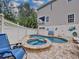 Private pool and hot tub with brick patio and lounge chairs at 219 81St St, Holmes Beach, FL 34217