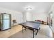 Basement game room featuring ping pong table and refrigerator at 219 81St St, Holmes Beach, FL 34217