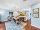 Dining area with hardwood floors and decorative rug at 219 81St St, Holmes Beach, FL 34217