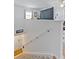 Beige carpeted staircase leading to lower level at 4850 51St W St # 4204, Bradenton, FL 34210