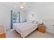 Comfortable bedroom with a queen bed, nightstand, and window at 4850 51St W St # 4204, Bradenton, FL 34210