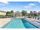 Refreshing community pool area with lounge chairs at 4850 51St W St # 4204, Bradenton, FL 34210