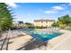 Community swimming pool with lounge chairs at 4850 51St W St # 4204, Bradenton, FL 34210