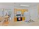 Kitchen with wood cabinets and a view of the dining area at 4850 51St W St # 4204, Bradenton, FL 34210