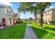 Well-manicured lawn and walkway between buildings at 4850 51St W St # 4204, Bradenton, FL 34210