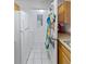 White kitchen appliances and adjacent laundry area at 4850 51St W St # 4204, Bradenton, FL 34210