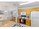 Kitchen with wood cabinets, stove, and sink at 4850 51St W St # 4204, Bradenton, FL 34210