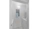 Functional laundry room with washer, dryer, and overhead shelving at 4850 51St W St # 4204, Bradenton, FL 34210