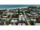 Picturesque coastal neighborhood and location of blue home near white sand beach at 4805 2Nd Ave, Holmes Beach, FL 34217