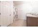 Bright bathroom with tile flooring and a shower with a floral curtain at 7380 Mikasa Dr, Punta Gorda, FL 33950