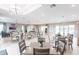 Bright community room offering tables and chairs for gatherings and socializing at 7380 Mikasa Dr, Punta Gorda, FL 33950