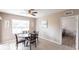 Cozy dining room features a large window providing natural light with an adjacent doorway to another room at 7380 Mikasa Dr, Punta Gorda, FL 33950