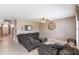 Spacious living room with a large sectional sofa, ceiling fan, and neutral wall color at 7380 Mikasa Dr, Punta Gorda, FL 33950