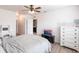 Light and airy main bedroom with two dressers and light-toned wood-look floors at 7380 Mikasa Dr, Punta Gorda, FL 33950