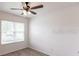 Bright bedroom with ceiling fan and large window at 7380 Mikasa Dr, Punta Gorda, FL 33950