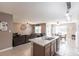 Open kitchen with island and breakfast bar at 7380 Mikasa Dr, Punta Gorda, FL 33950