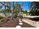 Backyard featuring a rope swing, a hammock, and lush landscaping at 506 69Th St, Holmes Beach, FL 34217