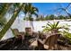 Secluded backyard patio with wicker seating, perfect for relaxation at 506 69Th St, Holmes Beach, FL 34217