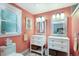 Stylish bathroom features dual vanities, modern fixtures, and charming decor, offering a luxurious and comfortable experience at 506 69Th St, Holmes Beach, FL 34217