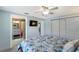 Well-appointed bedroom with a TV, closet, and adjacent bathroom, creating a private and comfortable living space at 506 69Th St, Holmes Beach, FL 34217