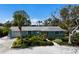 Charming, light-blue single-story home with mature landscaping and paver walkway at 506 69Th St, Holmes Beach, FL 34217