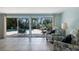 Inviting living room with seamless access to the pool and patio area, providing a serene indoor-outdoor living experience at 506 69Th St, Holmes Beach, FL 34217