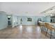 Open floorplan with tile floors, a large kitchen island, and a view to the front door at 506 69Th St, Holmes Beach, FL 34217