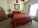 Serene bedroom featuring a double bed and wood furniture at 5146 Northridge Rd # 201, Sarasota, FL 34238