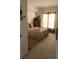 Cozy bedroom with large windows and plush bedding at 5146 Northridge Rd # 201, Sarasota, FL 34238