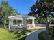 Relaxing spa with pergola and walkway, offering a tranquil community amenity at 5146 Northridge Rd # 201, Sarasota, FL 34238