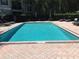 Clean, rectangular pool with plenty of lounge chairs at 5146 Northridge Rd # 201, Sarasota, FL 34238
