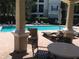 Refreshing community pool with patio seating at 5146 Northridge Rd # 201, Sarasota, FL 34238