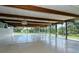 Spacious community room with wood beams and large windows at 3225 Duncan Way, Sarasota, FL 34239